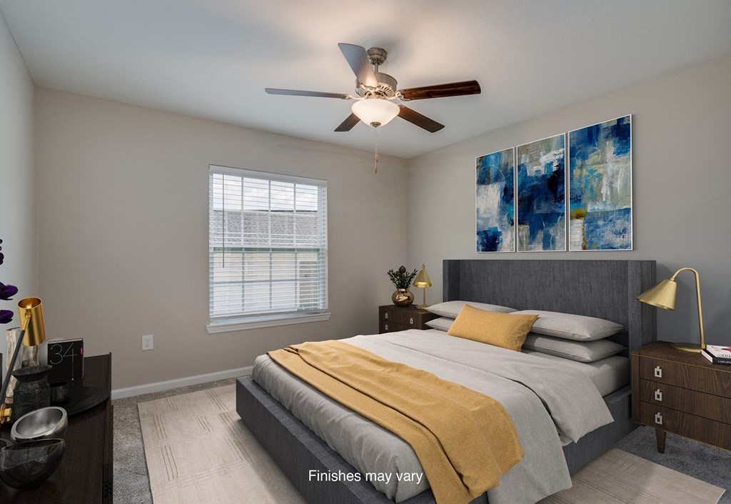 a bedroom with a bed and a ceiling fan  at Killian Lakes Apartments and Townhomes, South Carolina, 29203