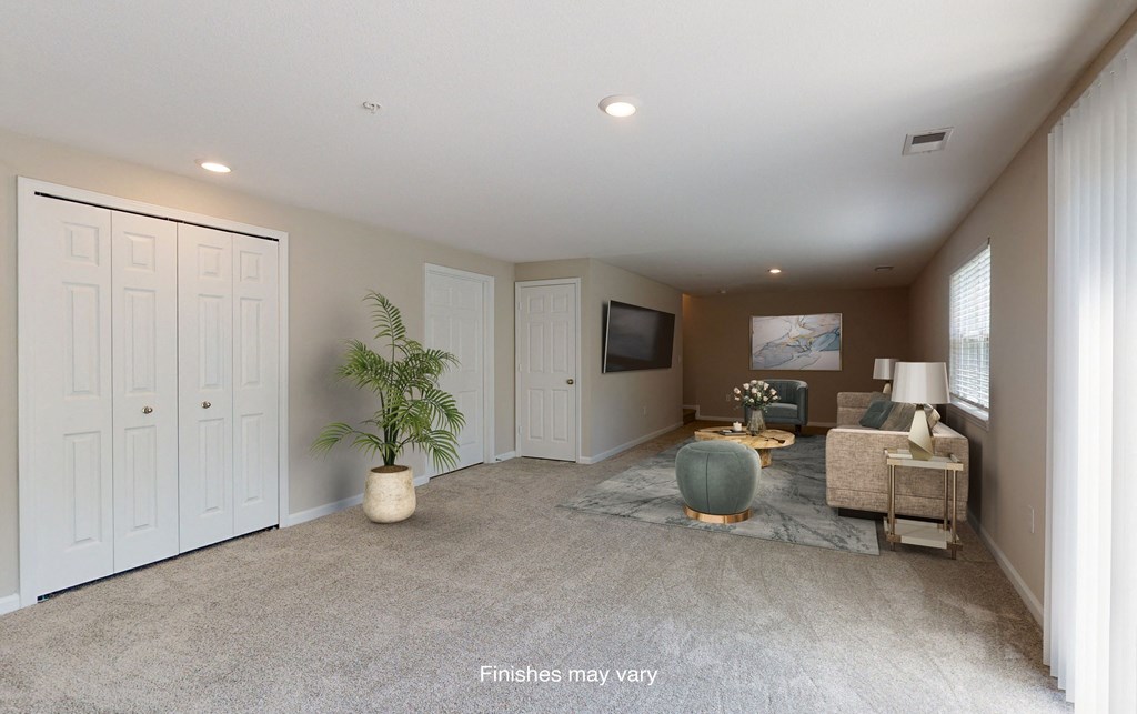 a living room with a couch and a tv  at Killian Lakes Apartments and Townhomes, Columbia, SC