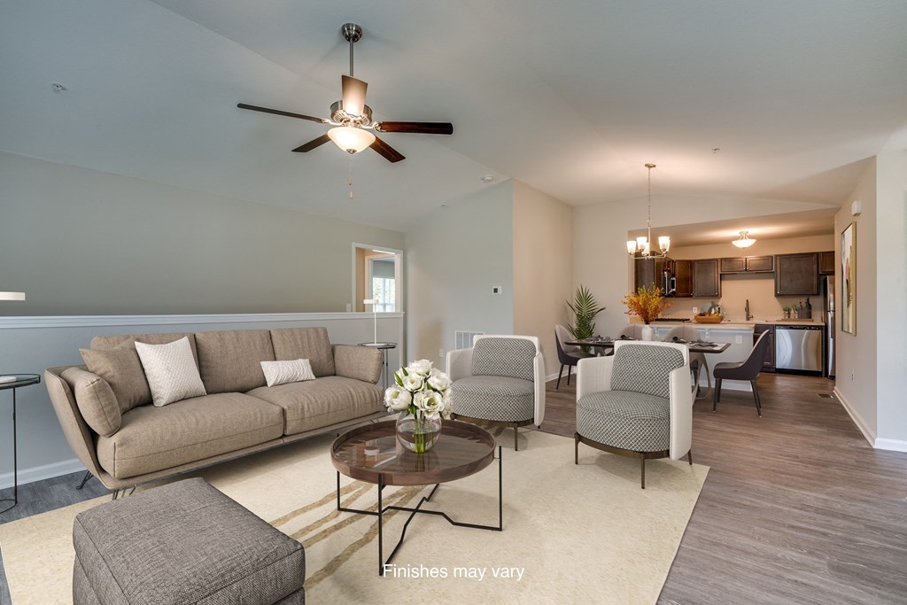 a living room with couches and chairs and a ceiling fan  at Killian Lakes Apartments and Townhomes, South Carolina, 29203