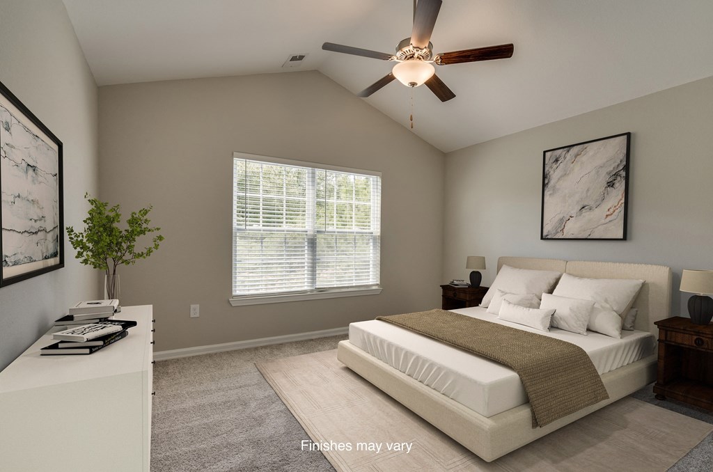 a bedroom with a bed and a ceiling fan  at Killian Lakes Apartments and Townhomes, Columbia, 29203