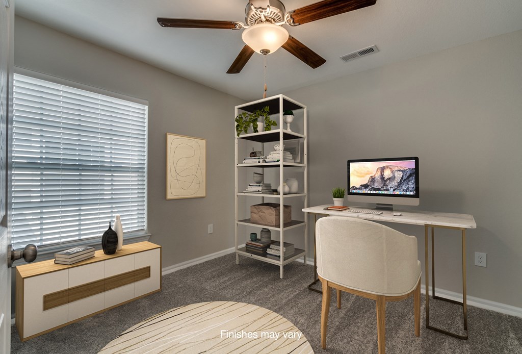 an office with a computer and a desk with a chair  at Killian Lakes Apartments and Townhomes, Columbia, 29203