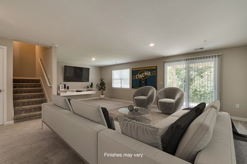 a living room with a couch and chairs and a tv  at Killian Lakes Apartments and Townhomes, South Carolina, 29203