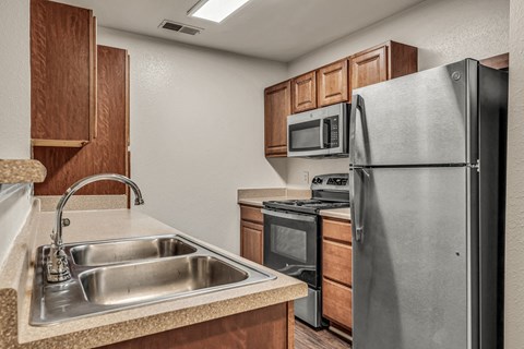 a kitchen with stainless steel appliances and a sink