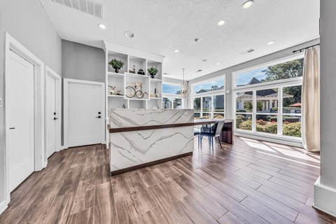 a kitchen with a marble counter top and a large window at Trophy Club at Bellgrade, Midlothian, VA, 23113