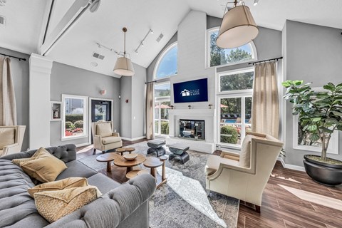 a living room with a couch and chairs and a fireplace at Trophy Club at Bellgrade, Midlothian, VA, 23113