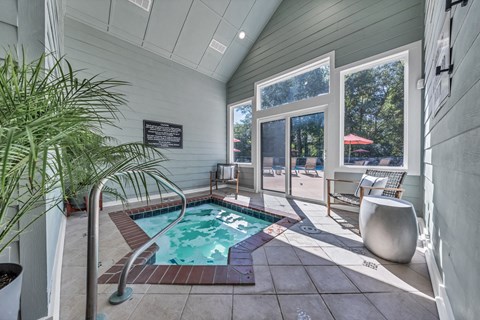 a small pool in the corner of a house with a sliding glass door at Trophy Club at Bellgrade, Midlothian, VA, 23113
