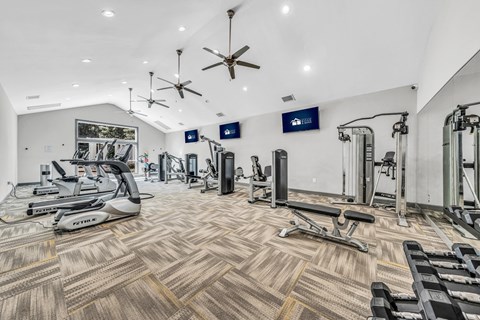 the gym is equipped with treadmills and other exercise equipment at Trophy Club at Bellgrade, Midlothian, VA, 23113