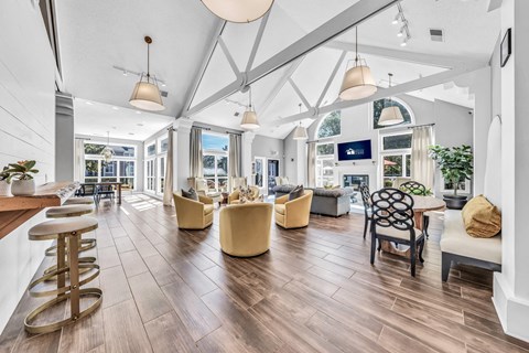 a large living room with chairs and tables and a large windows at Trophy Club at Bellgrade, Midlothian, VA, 23113