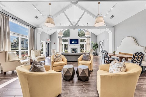 a living room with couches and chairs and a fireplace at Trophy Club at Bellgrade, Midlothian, VA, 23113
