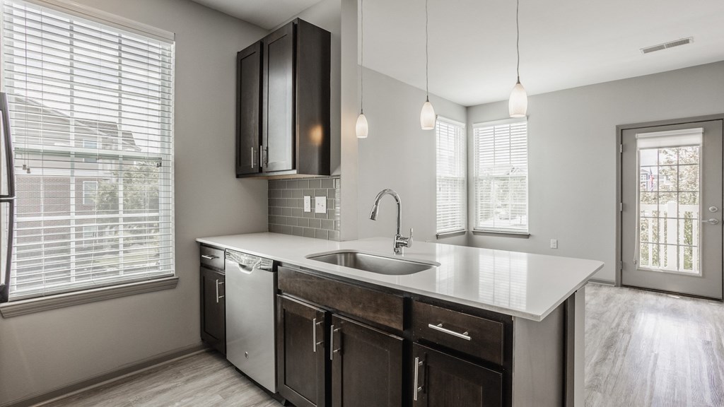 an empty kitchen with a sink and a window at The Avenue at Polaris Apartments, Columbus, OH