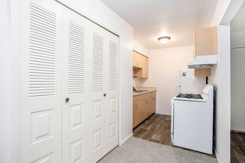a kitchen with a large closet at Fairlane Apartments in Springfield, MI