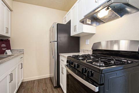 a kitchen with stainless steel appliances at Old Farm Apartments, Elkhart, Indiana