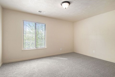 bedroom with a large window at Old Farm Apartments, Elkhart, Indiana