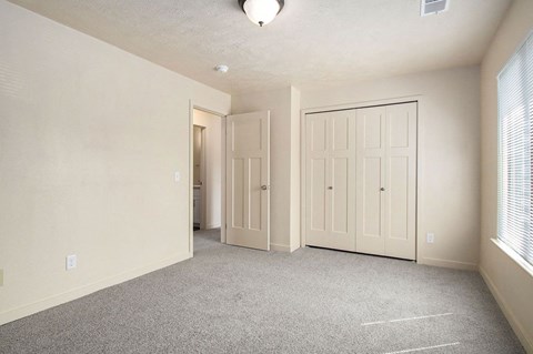 upgraded bedroom has plenty of closet space at Old Farm Apartments, Elkhart, Indiana