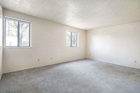 studio living room with two windows at Old Farm Apartments, Elkhart, Indiana