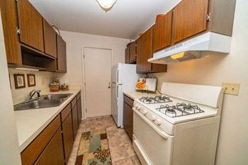 Galley Style Kitchen at Old Farm Apartments in Elkhart, IN