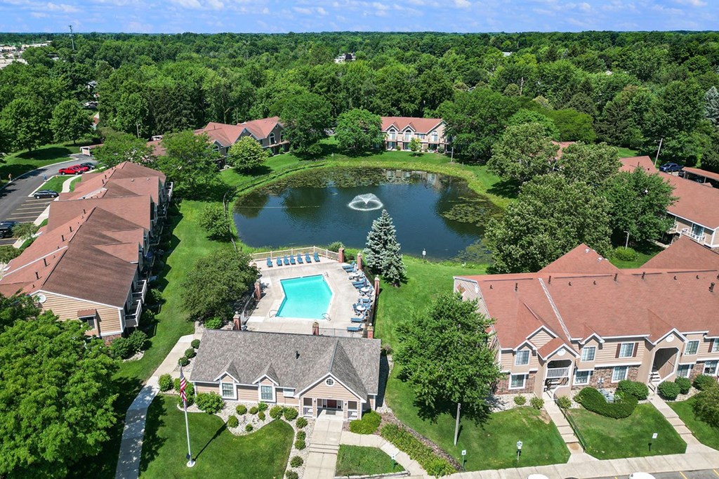 an aerial view of Hampton Lakes neighborhood with a swimming pool and a pond, Walker, MI