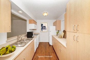 Kitchen with Plank Flooring at Foxwood Apartments and The Hermitage Townhomes, Portage, MI 49024