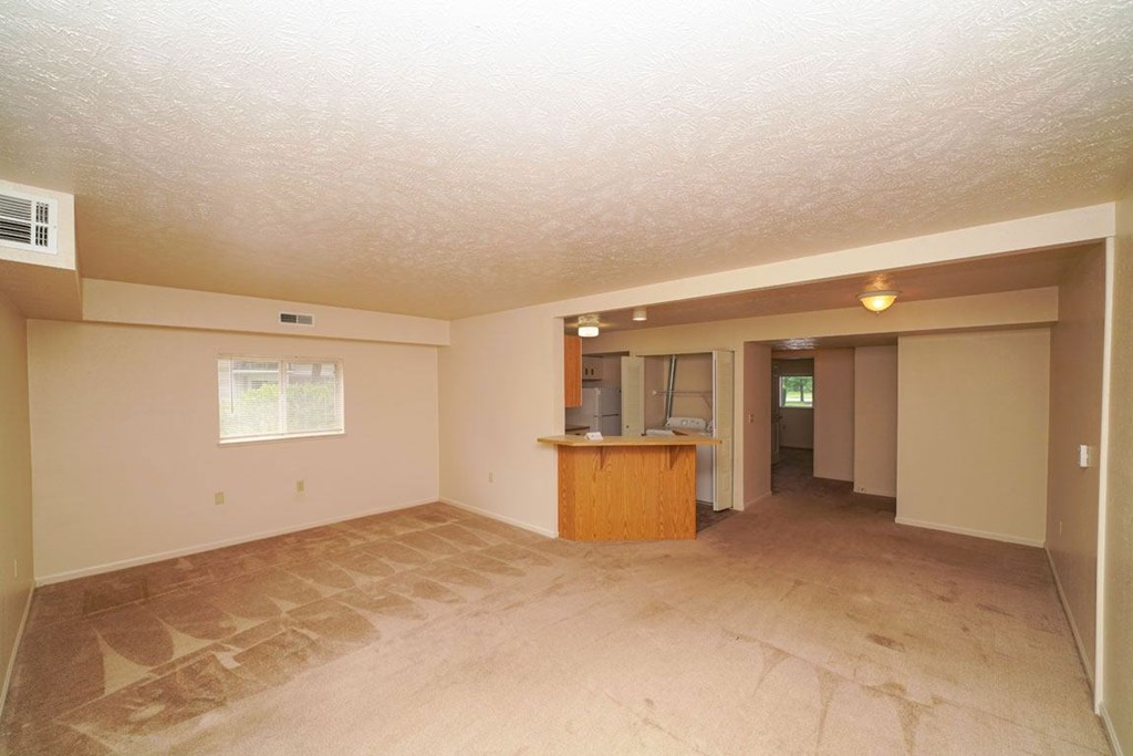 End living/dining room and a kitchen at Huntington Cove Apartments, Merrillville, 46410