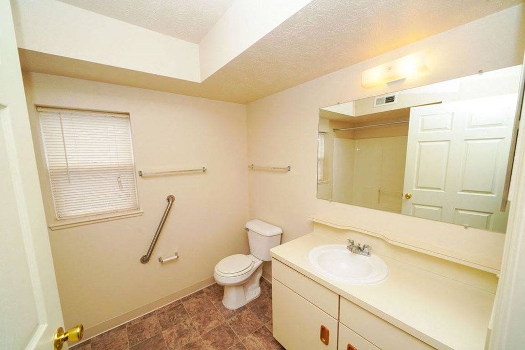 a bathroom with a window at Huntington Cove Apartments, Indiana, 46410
