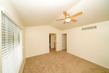 Master Bedroom with Vaulted Ceiling at Foxwood Apartments and The Hermitage Townhomes, Portage, MI 49024