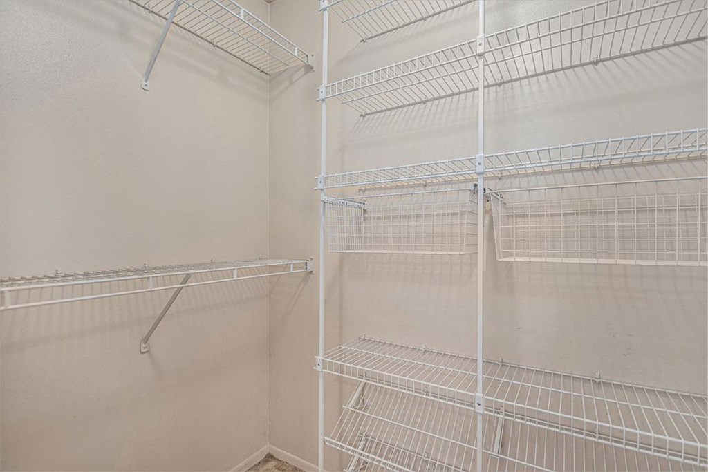 the walk in closet in the master bedroom has white wire shelves at Indian Lakes Apartments, Mishawaka