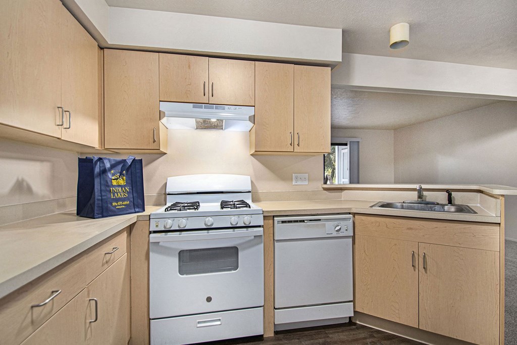 Kitchen with breakfast bar at Indian Lakes Apartments, Mishawaka, IN
