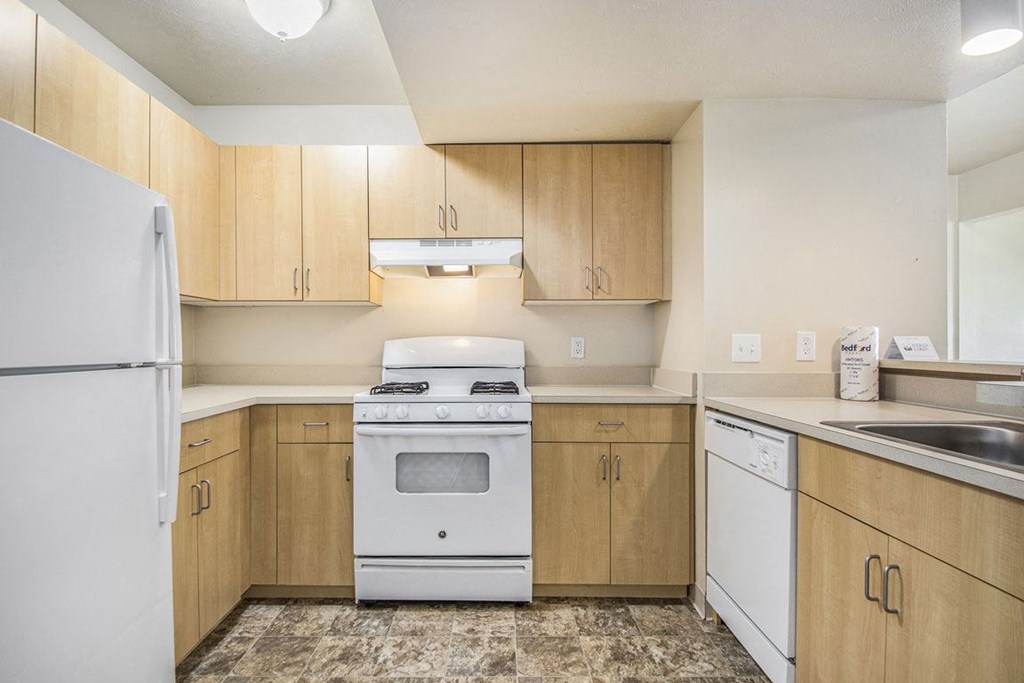 Kitchen with Dishwasher and Gas Range at Indian Lakes Apartments, Mishawaka, IN