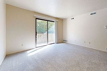 living room with a sliding door to a balcony at Irish Hills Apartments, Indiana, 46614