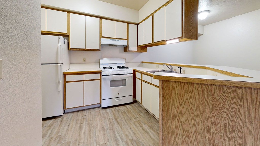 a kitchen with a breakfast bar at Irish Hills Apartments, Indiana, 46614