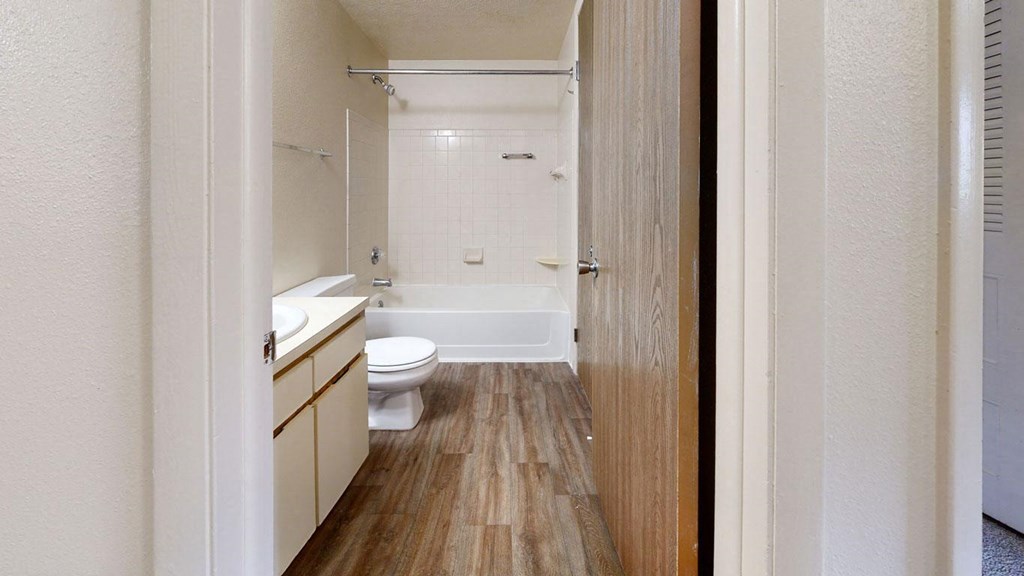 first bathroom with a bathtub/shower combination at Irish Hills Apartments, South Bend, 46614
