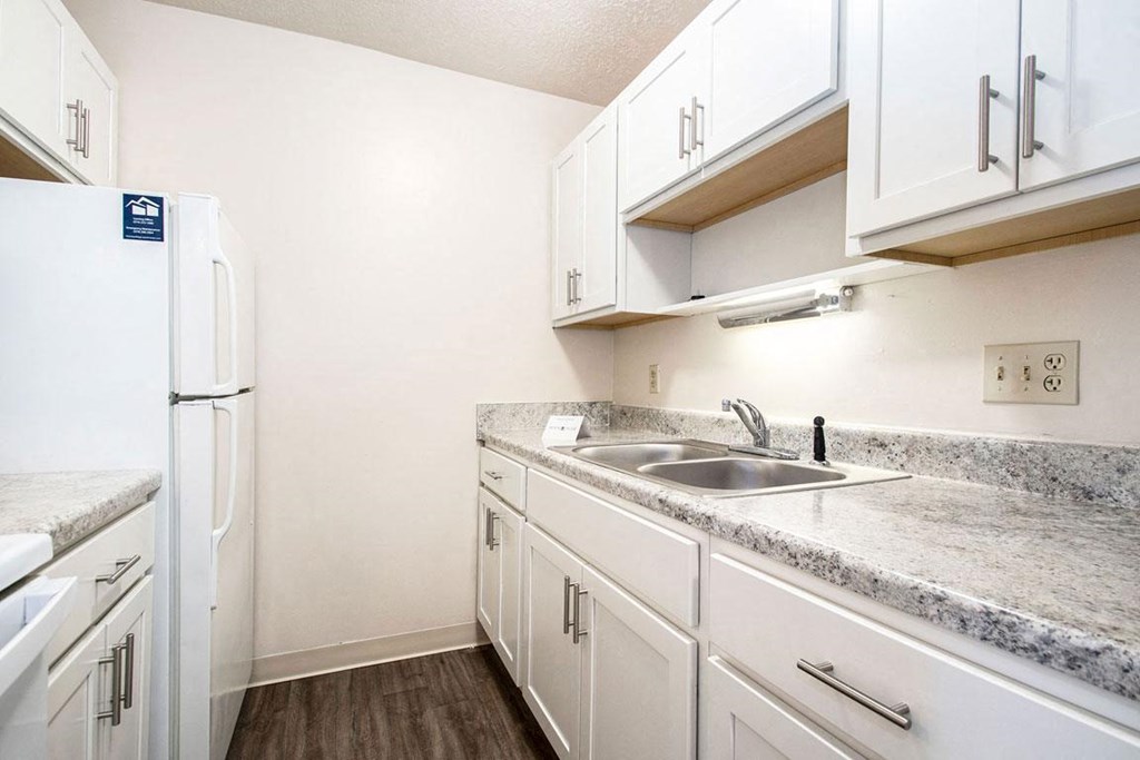 renovated kitchen with white cabinets at Irish Hills Apartments, South Bend