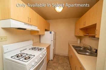 Fully Equipped Kitchen with Gas Stove at Irish Hills Apartments in South Bend, IN