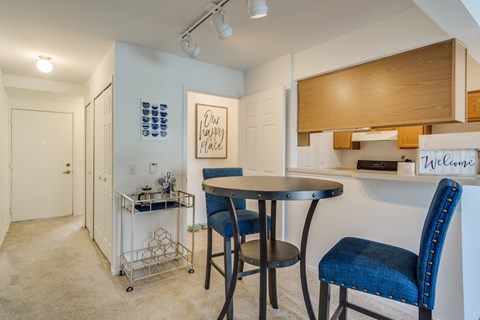 A dining area with a table and chairs  at Northport Apartments, Macomb, MI, 48044