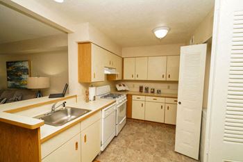 Kitchen with Breakfast Bar at Brentwood Park Apartments in Nebraska