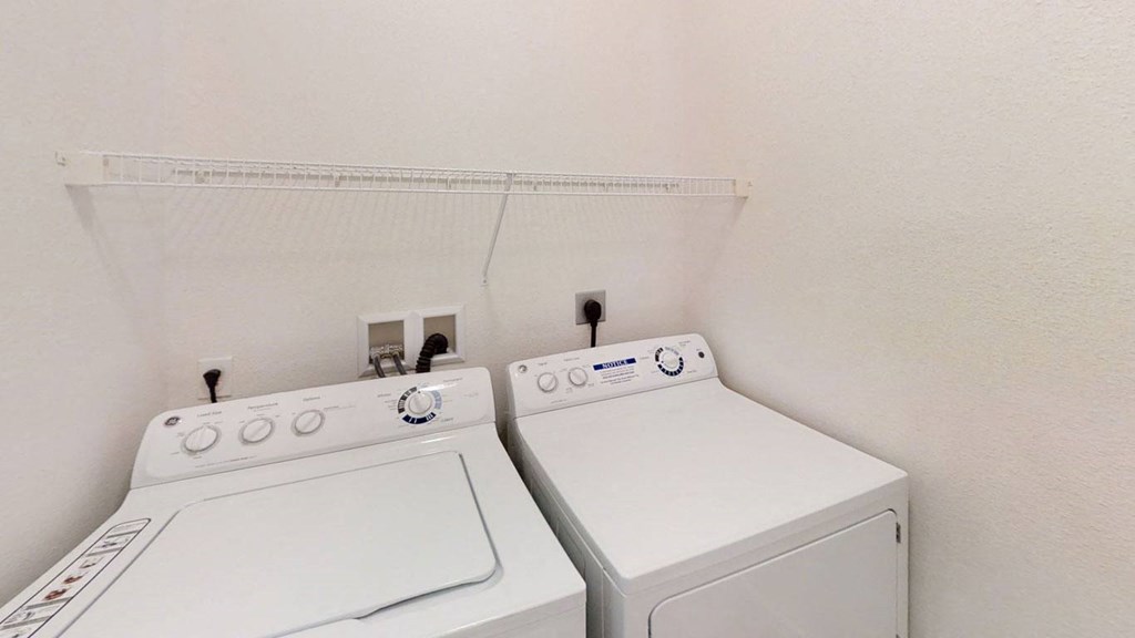 A washer and dryer in a laundry room at Lynbrook Apartment Homes and Townhomes, Elkhorn