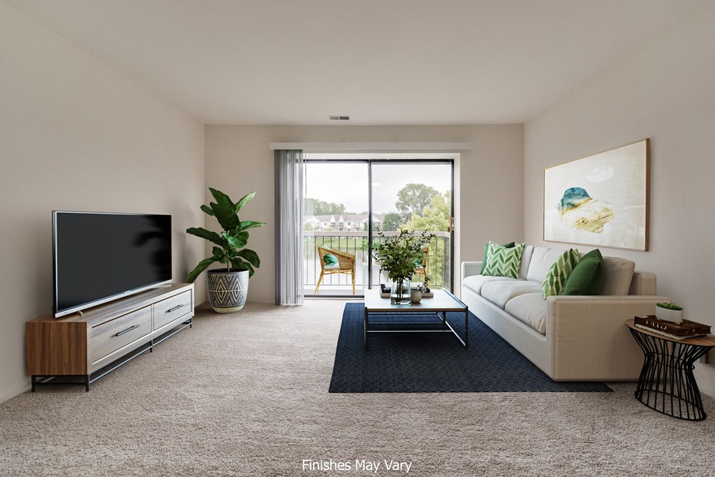a living room with a couch and coffee table at The Landings Apartments, Westland, MI