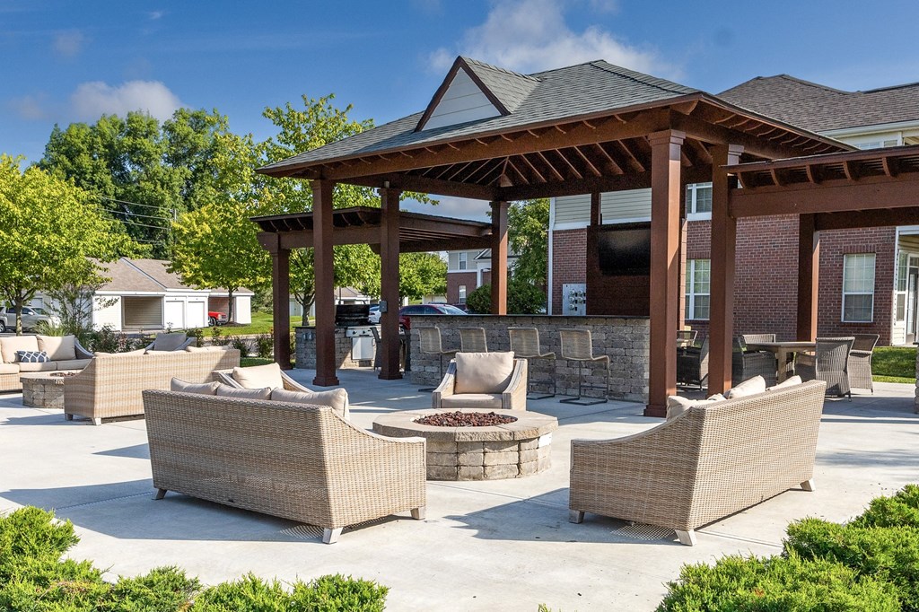 a patio with couches and a pavilion with a fire pit at Latitudes Apartments, Indianapolis, IN
