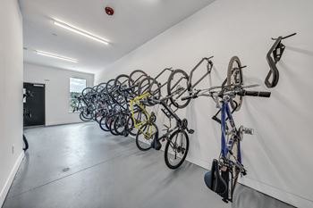 A bike rack with many bikes on it