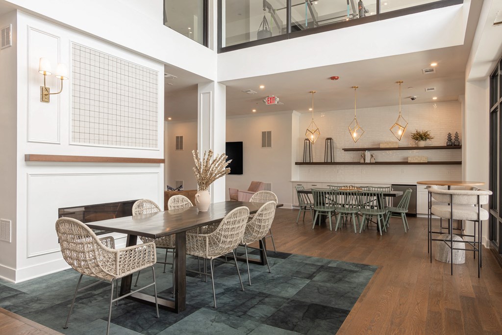 A dining room with a table and chairs at Luxe 360 on Centerpointe Apartments, Midlothian, VA