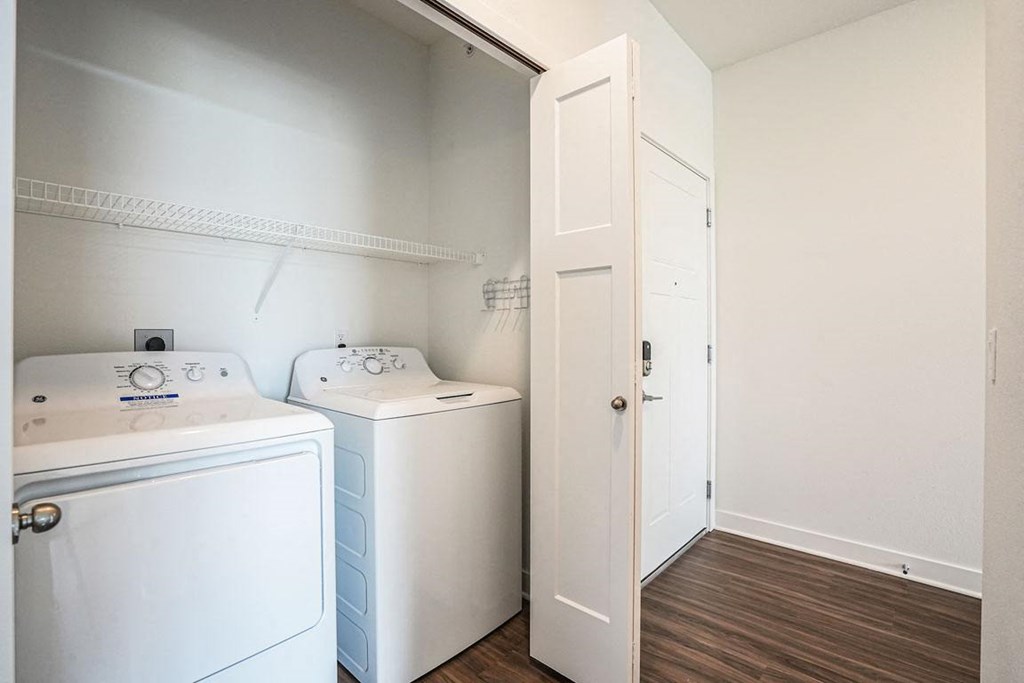 a laundry room with a washer and dryer at Meadowbrooke Apartment Homes, Grand Rapids, Michigan