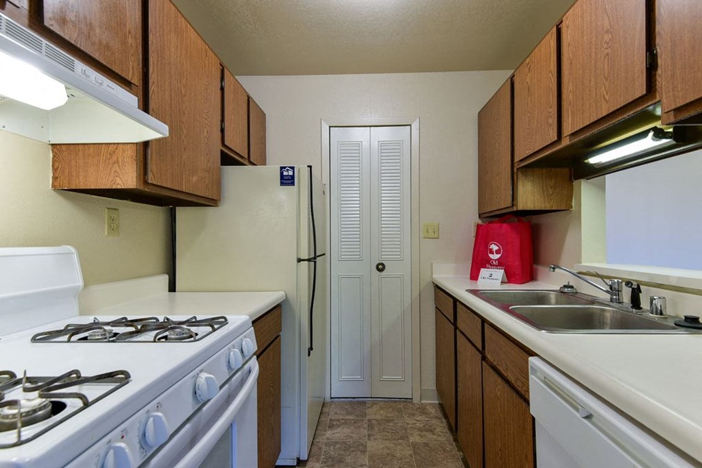 Galley Kitchen with Dishwasher and Pantry at Old Monterey Apartments, Missouri, 65807