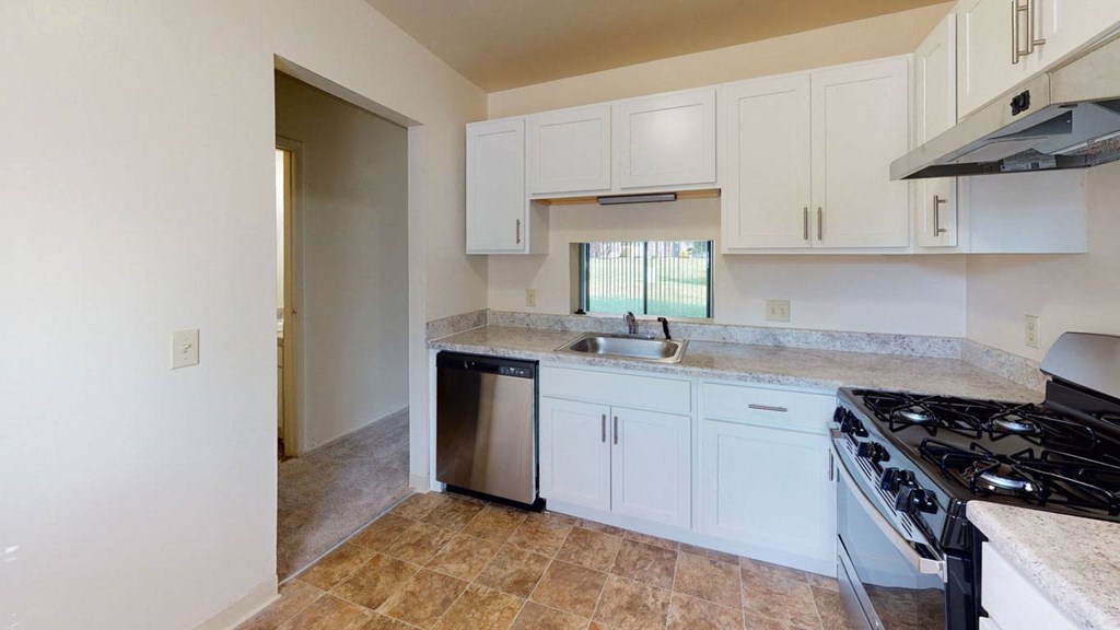 Upgraded kitchen with white cabinets at Mount Royal Townhomes, Michigan