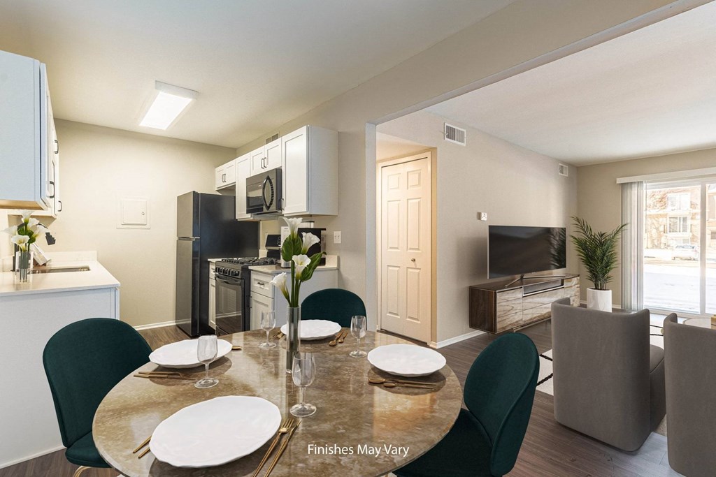 a kitchen and dining area in a 555 waverly unit at Cordoba Apartments, Farmington Hills, Michigan