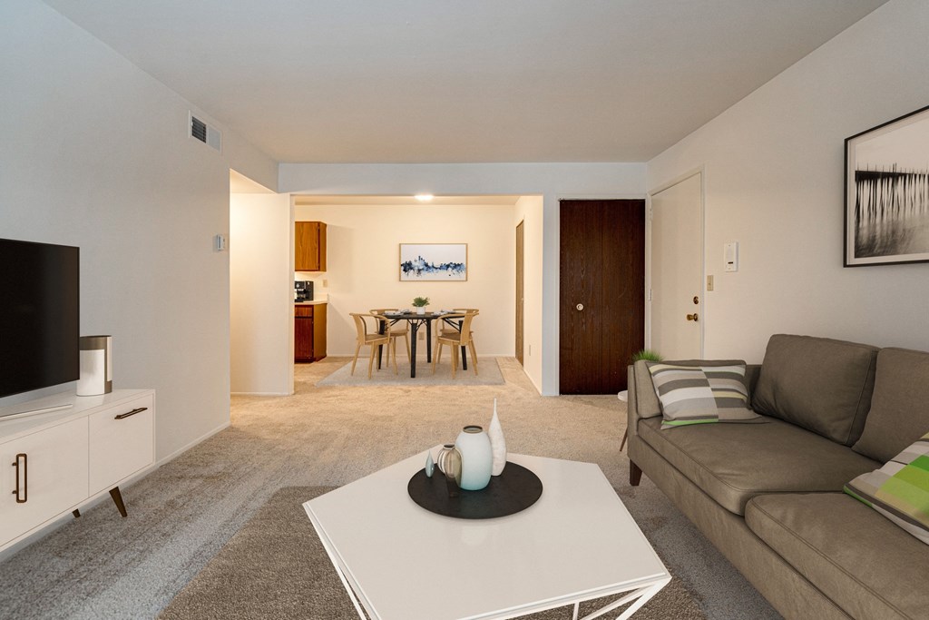 Magnolia Layout Living Room with Dining View at Fox Pointe Apartments, East Moline, IL 61244