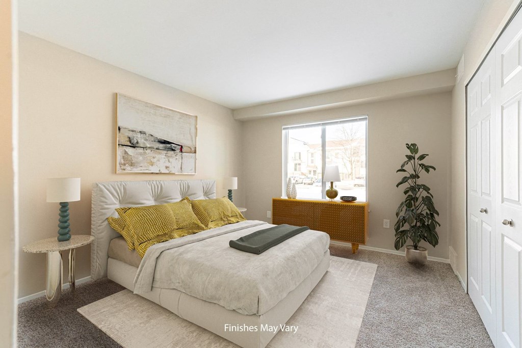 a bedroom with a large bed and a large window at Cordoba Apartments, Farmington Hills, MI, 48334