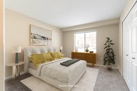 a bedroom with a large bed and a large window at Cordoba Apartments, Farmington Hills, MI, 48334