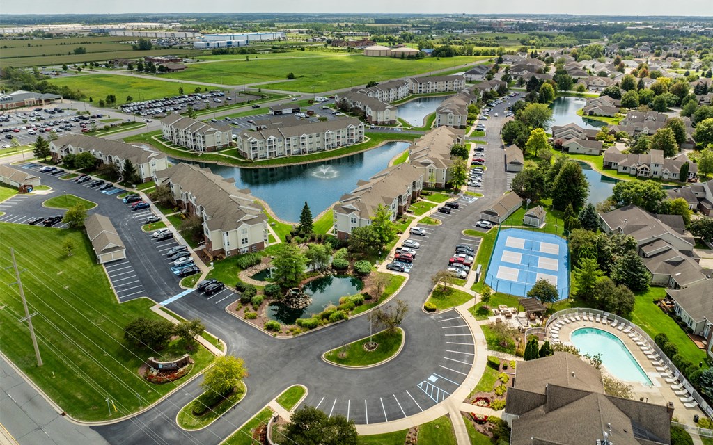 A large, well-maintained residential area with a swimming pool and a roundabout at Mallard Bay Apartments, Crown Point, Indiana