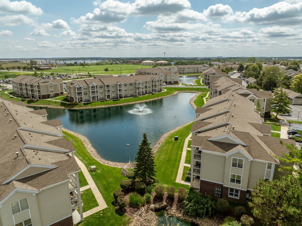 A large lake is surrounded by apartment buildings at Mallard Bay Apartments, Crown Point, Indiana