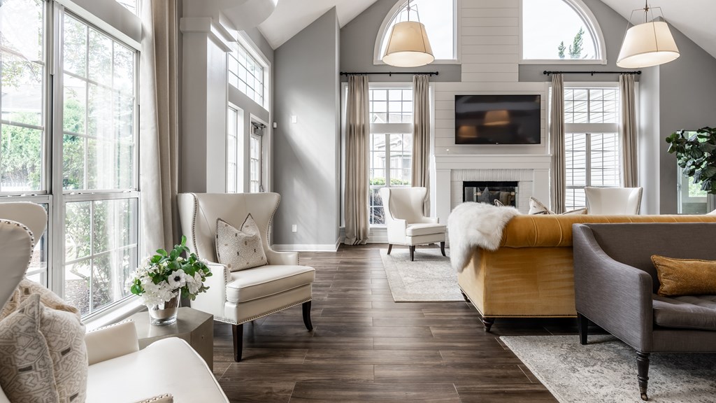 A living room with a fireplace and a couch at Mallard Bay Apartments, Crown Point, Indiana